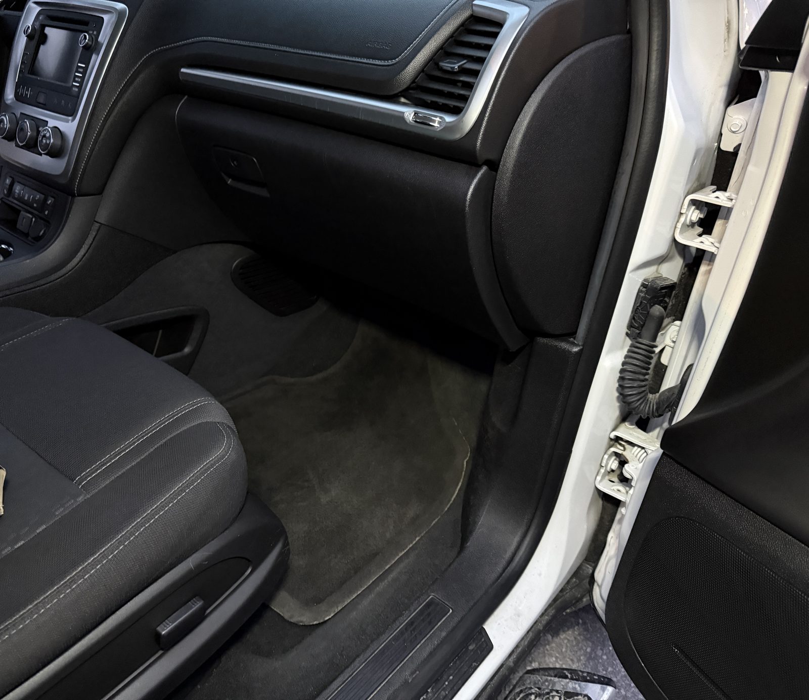 Spotless passenger footwell after full interior detail